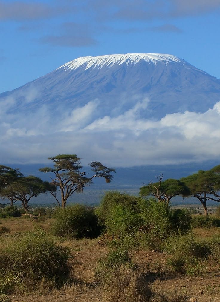 Kilimanjaro's snow-capped crown rising above the African plains