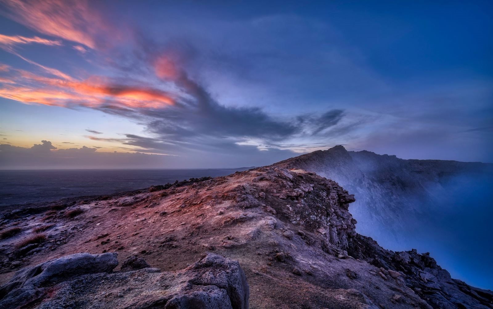 A guide walking with travellers through the Ethiopian highlands